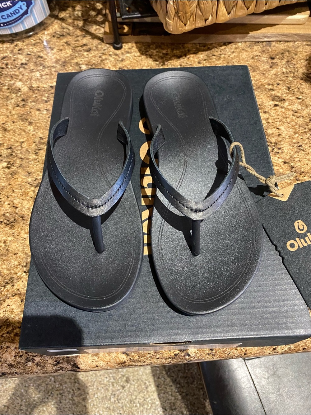 Olukai W’s Black Flip Flop Sandals - Lava Rock